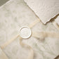 sage green floral vellum wrap with hand dyed silk ivory ribbon and white wax seal for wedding invitations