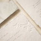 wedding rsvp card with blind letterpress leaf vine printed on handmade cotton paper and styled with beige dried flowers
